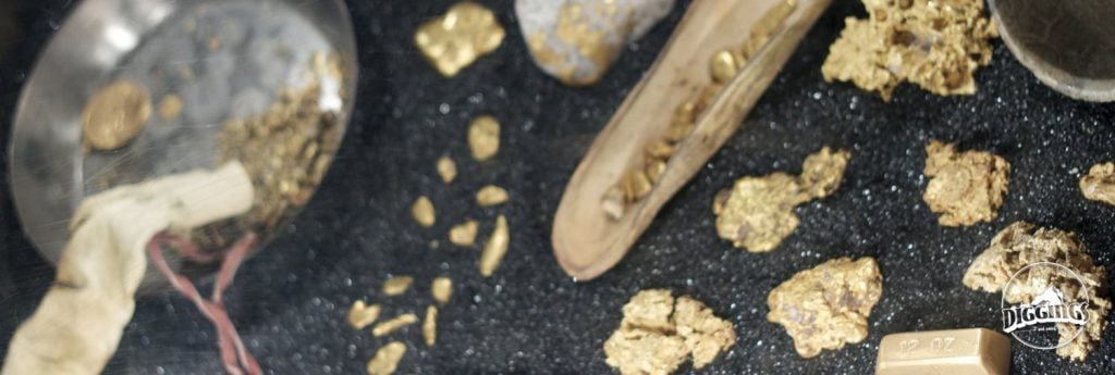 Display of gold in many different forms from placer to quartz gold to gold melted down into a bar.