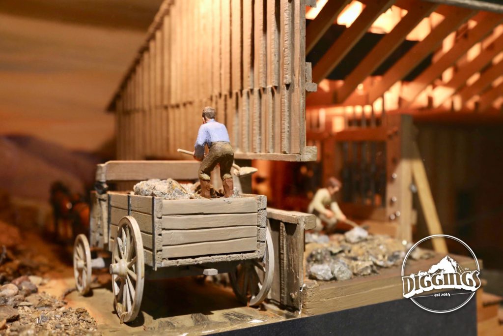 Shoveling ore into a mill diorama at the National Mining Hall of Fame & Museum tells the story of mining, its people, and its importance to the American public.