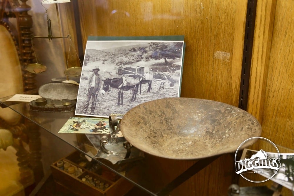 Prospectors, pans, and gold scales on display at the Gold Nugget Museum
